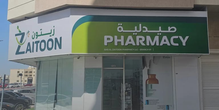 Pharmacy storefront with green and white flex sign board