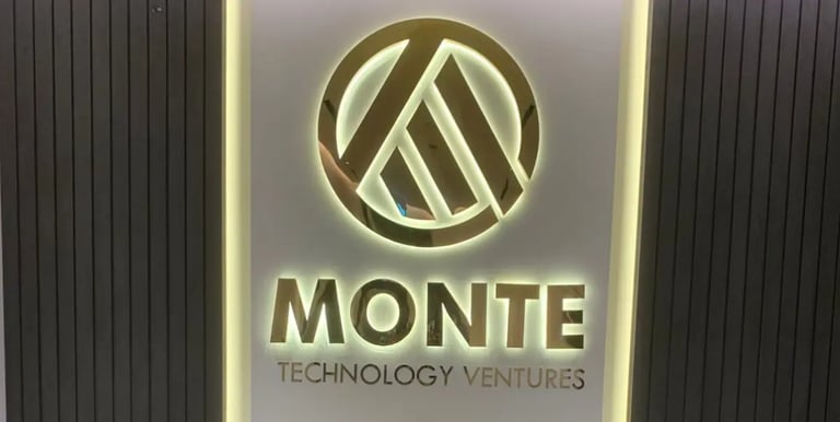 Monte Technology 3D Brushed Stainlesss Steel Signage with backlite behind reception desk of office
