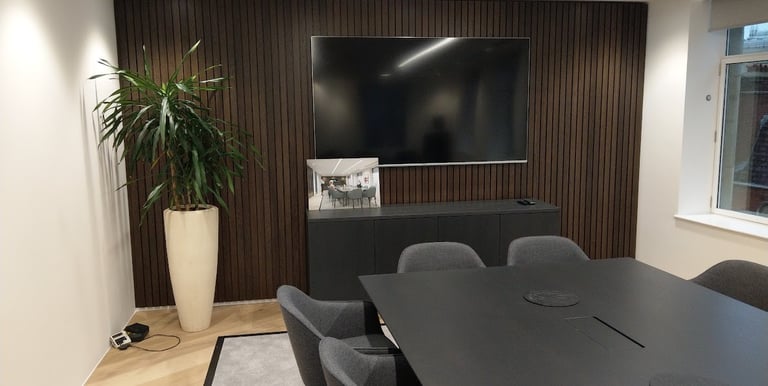 MountMyTV - Sony 85" TV mounted on wall in a boardroom