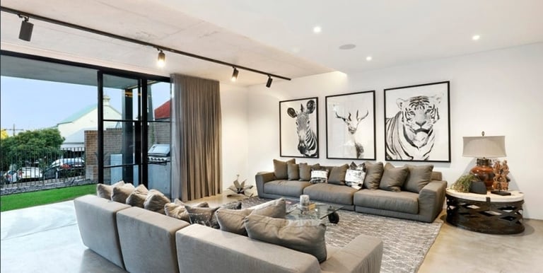 a living room with a couch and a large window