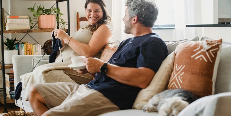 a man and woman sitting on a couch