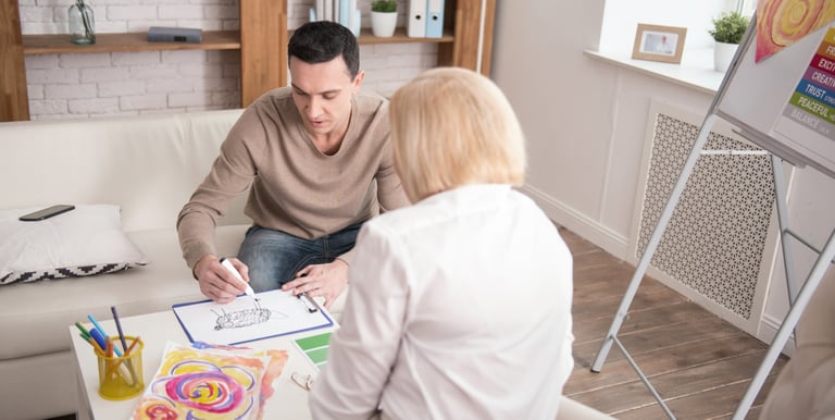 a man and woman sitting on a couch