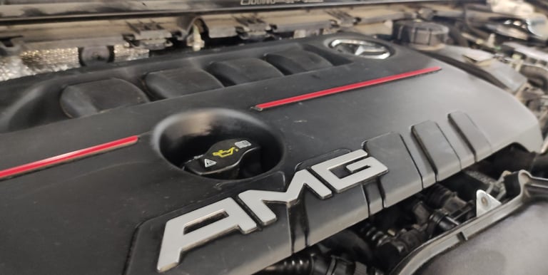 an Enlab Mercedes car engine with the word amg on it