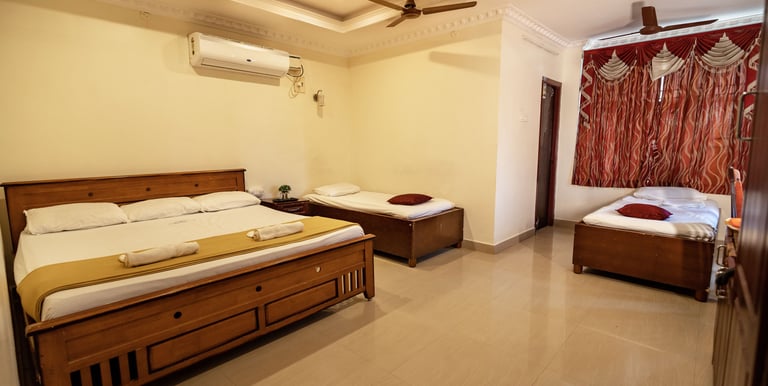 Spacious and clean deluxe room at Hotel Harish with modern amenities