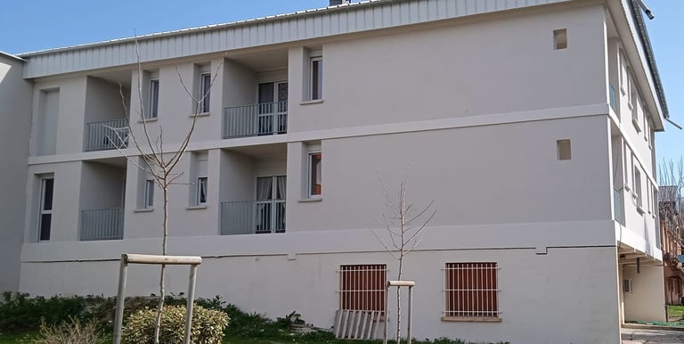 a building with a playground structure and a playground structure