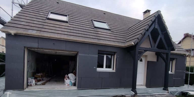 a house with a garage door and a garage door