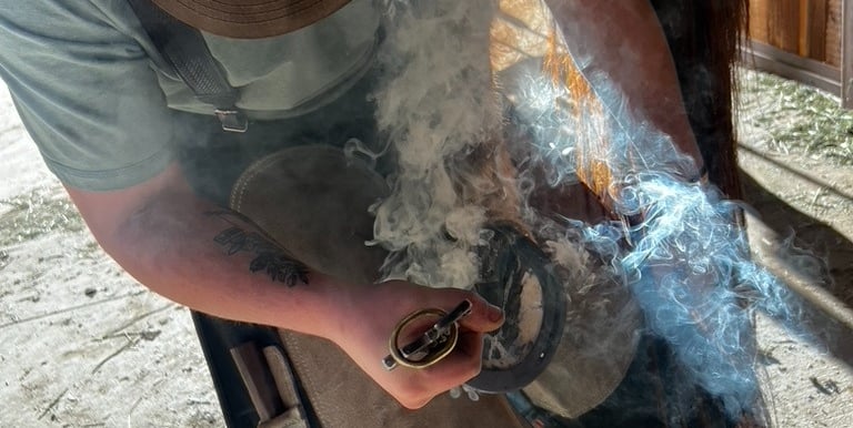 Mason hot shoeing a horse