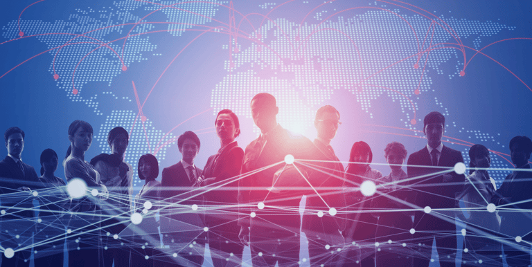Diverse business team silhouettes standing before a digital world map with global network connections.