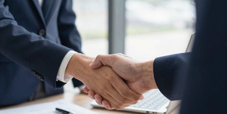 A friendly immigration officer assisting a client with visa paperwork in a bright, welcoming environment.