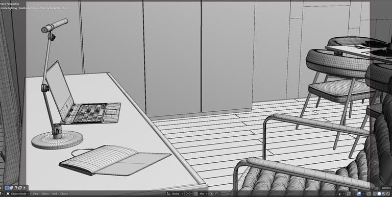 An image of a desk and office chair shown in wireframe view on the computer in Blander.