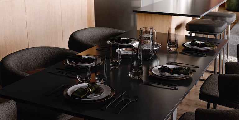 An image of a dining table with pace servings shown in rendered view on the computer in Blander.