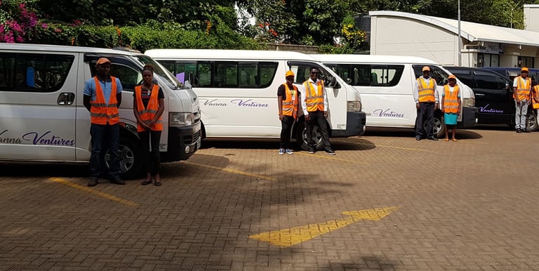 Professional staff standing by a fleet available for hire or leasing from Vanna Ventures