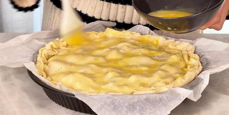 Fill, seal and brush the pie