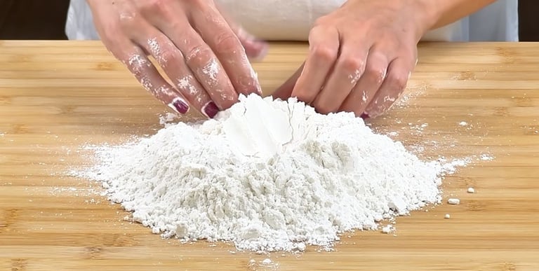 Make a well with the flour