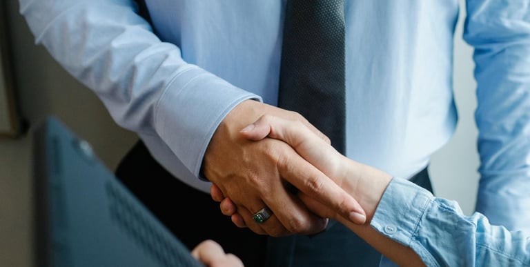 Handshake symbolising partnership and trust in after-sales consultancy