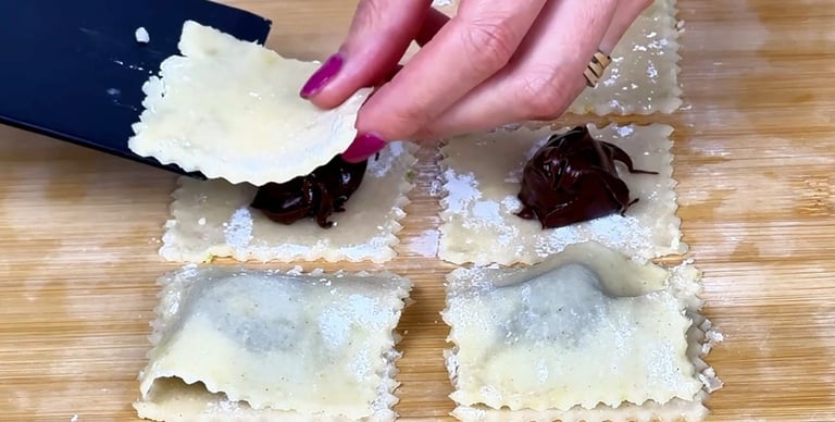 Place the frozen cream balls onto half of the pastry squares