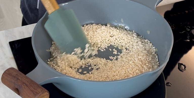 Toast the rice over medium heat for a few minutes, stirring constantly