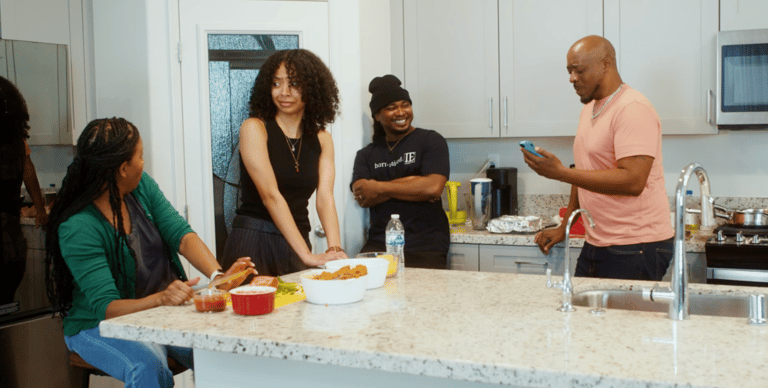 Characters Tasha, Meka, Darrell, Sam in kitchen