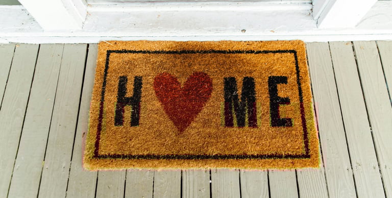 welcome mat that says home