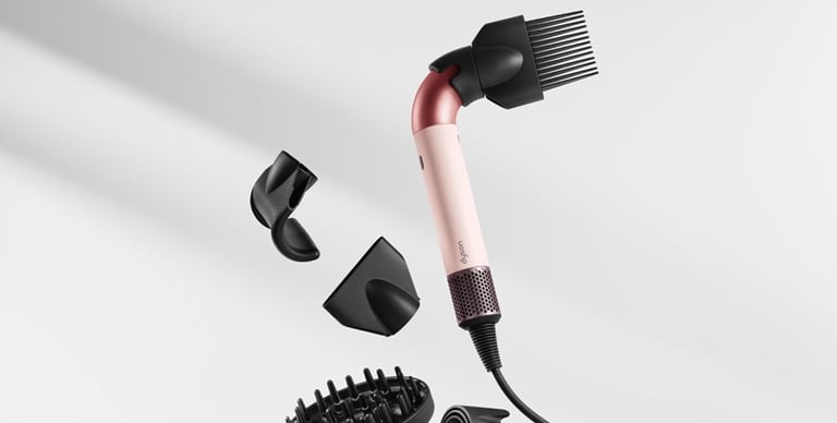 a hair dryer with a brush and a comb