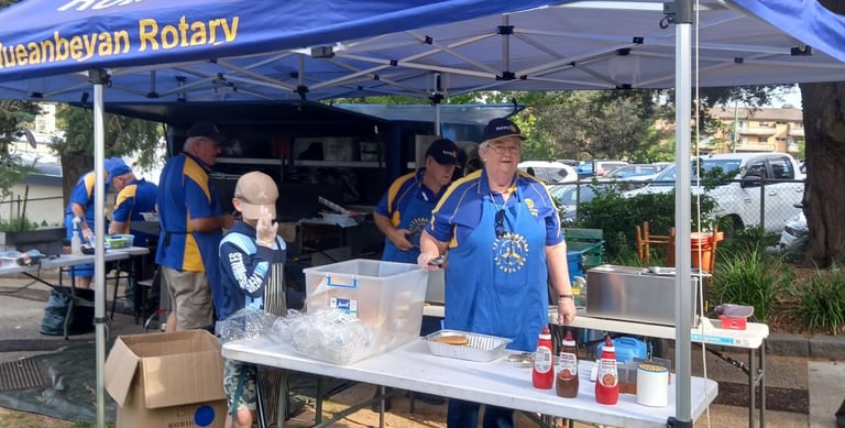 Queanbeyan Rotary volunteers cooking the BBQ at the Terry Campese Golf Competition