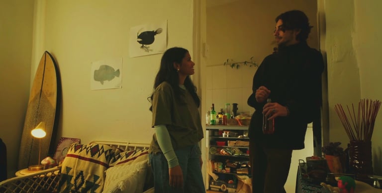 a man and woman standing in a living room