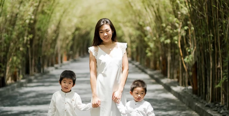 Siblings standing together during a natural family session at W Bali Seminyak