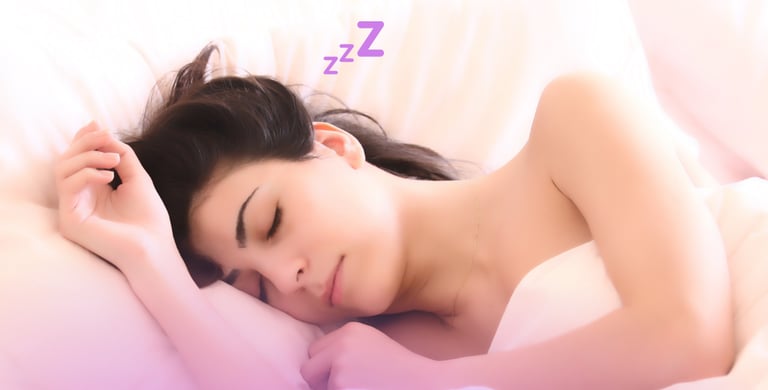 a woman sleeping in a bed with a pillow