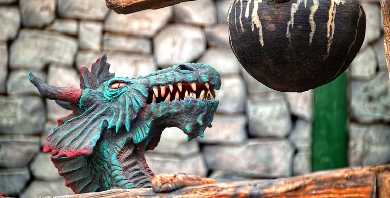 Immersive dragon-themed landmark with smoke effects designed for a themed dining and attraction zone