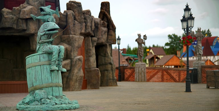 Landmark central plaza created with custom sculptures, immersive rockwork and themed world-building 