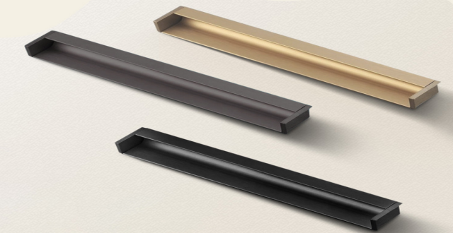 Champagne gold aluminum L-shape groove pull handle installed on a light oak kitchen drawer, showcasing 