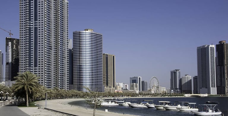 a city street with boats and buildings in the background