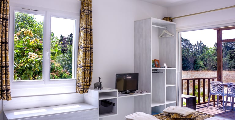 Bed with full bedding, floating bed with swimming pool view, olive grove view and garden at Domaine Des Lucques