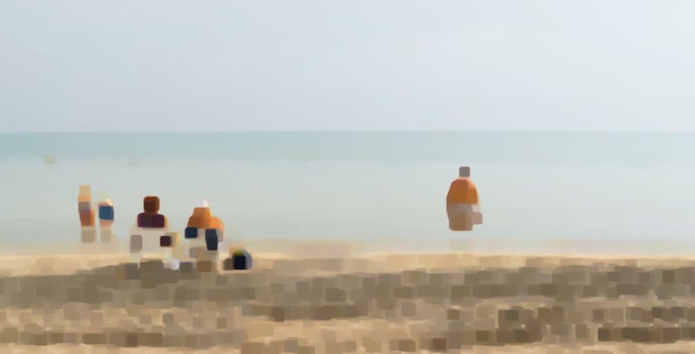a group of people sitting on a beach