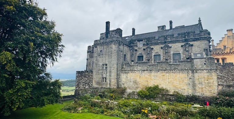 Stirling Castle with gardens and large tree in foregound