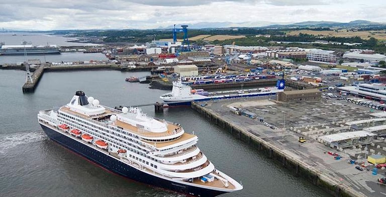 a cruise ship in the water with at Rosyth port