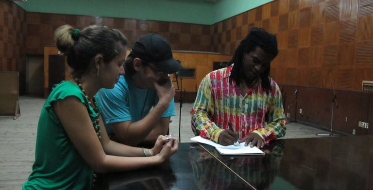 Rey Escobar with the Grammy Award Winner Mayito  Rivera (Van Van) and visual artist Daviana Basilio.