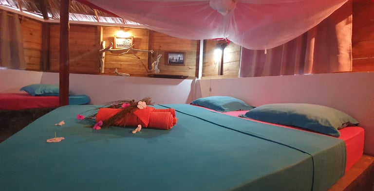 Bedroom inside a beachfront bungalow at Ocean Lodge, overlooking Sakalava Bay near Diego Suarez, Mad