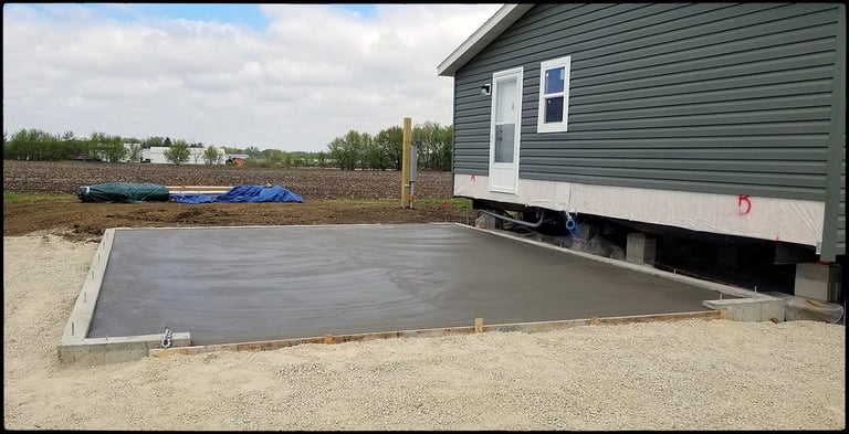 Concrete footings, poured concrete walls, and garage floors.