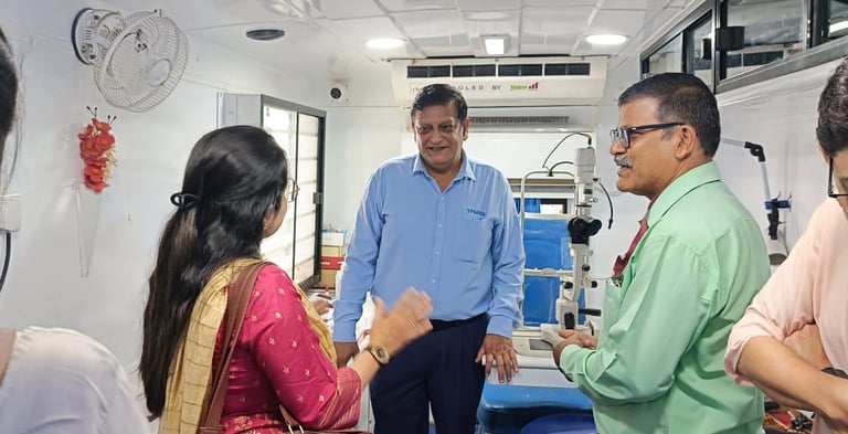 An Ophthalmologist interacting with a patient inside the Mobile Van
