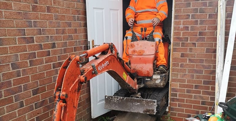 Digger operator preparing foundation for extension in West Bromwich and Handsworth