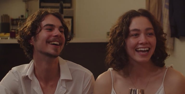 a man and woman sitting on a couch