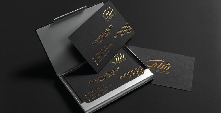 a black and gold business card with a business card