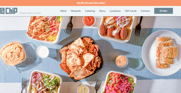 A website showing a flatlay of Middle Eastern food