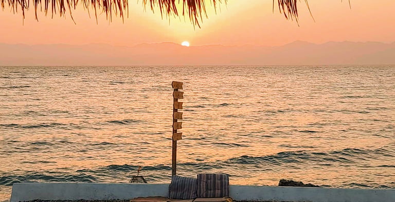 Sunrise over the Red Sea at Bedouin Star beach camp in Ras Shitan Egypt.