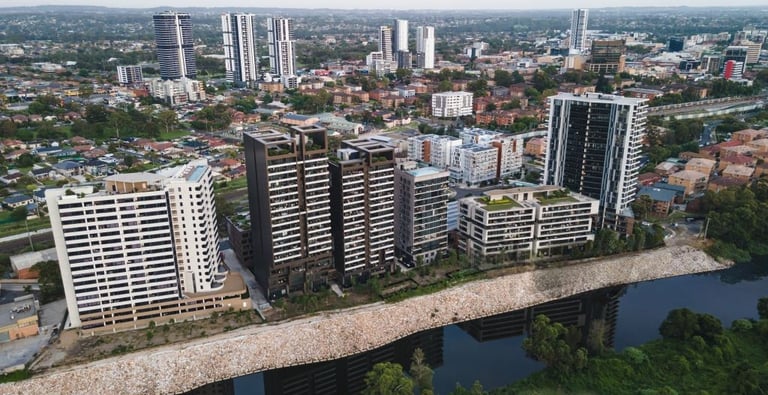 Aerial view of modern high-rise buildings and apartments along Georges River in Liverpool