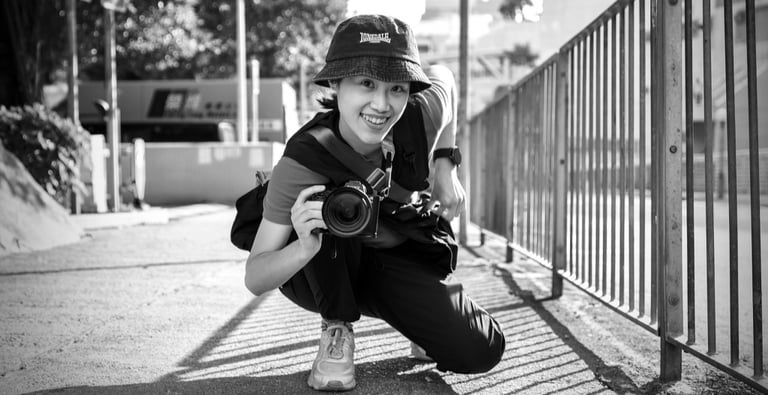 Young female street photographer with camera
