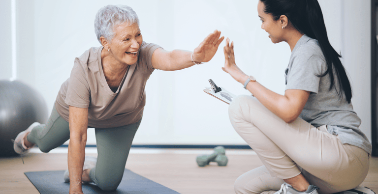 An older women doing physical therapy. 