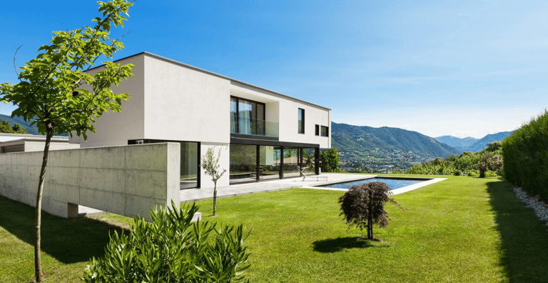 a house with a pool and a pool in the background