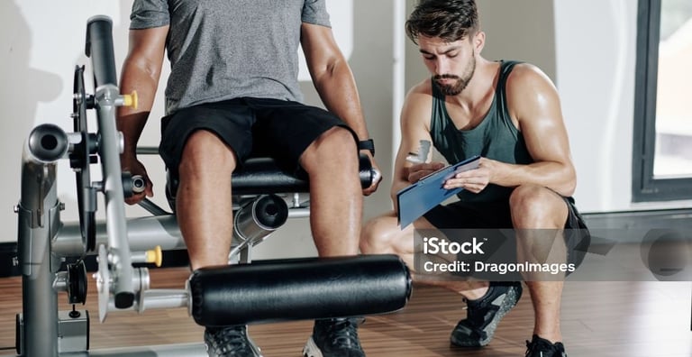 a man using a leg machine for exercise